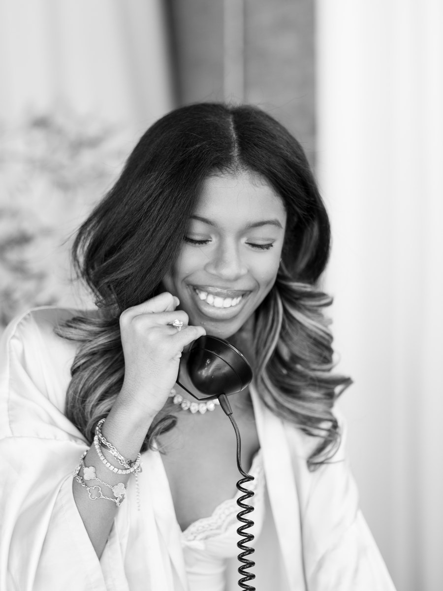 Ksymone on the phone, taking a conversation